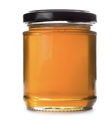clear honey in a jar with black lid