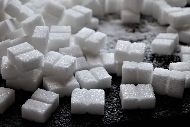 sugar cubes on a black counter